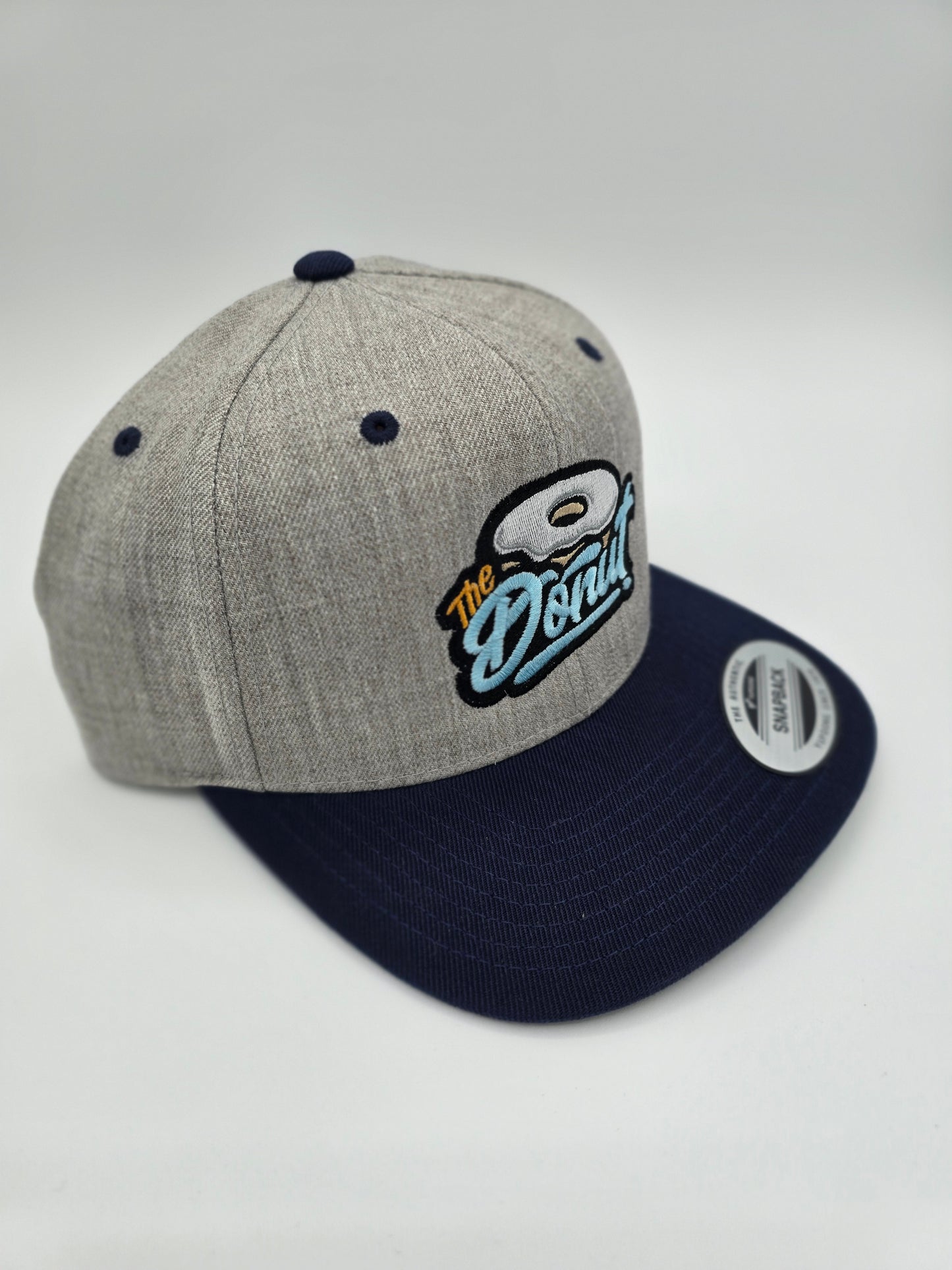 The Donut Light Gray and Navy Snapback Hat
