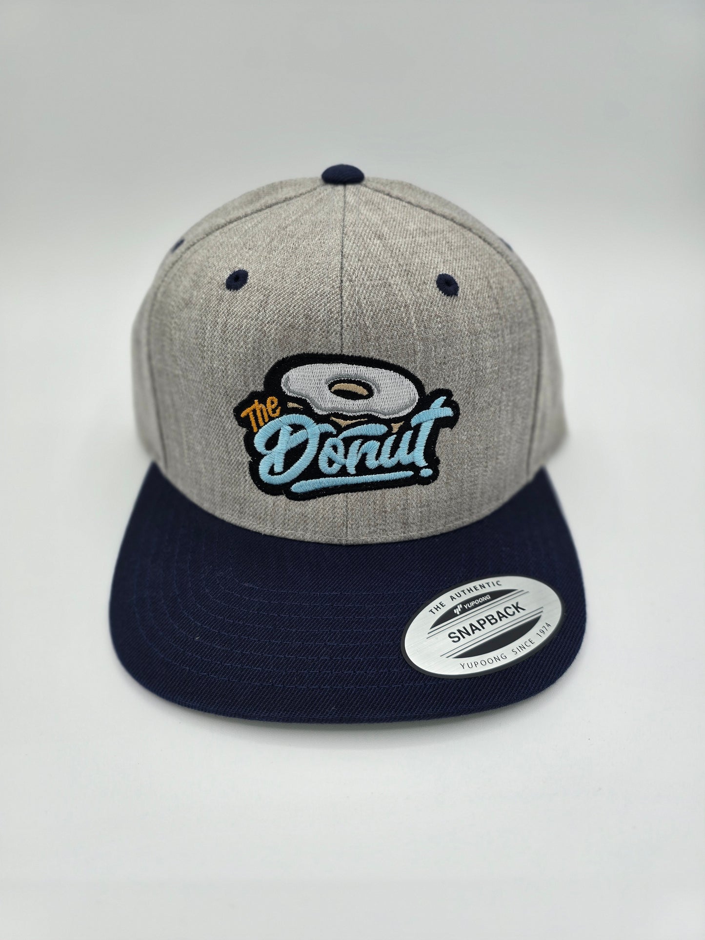 The Donut Light Gray and Navy Snapback Hat